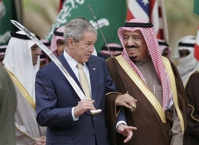 President Bush stands with Saudi Prince Salman, right, brother of Saudi King Abdullah, while watching a traditional sword dance at the Al Murabba Palace and Natural History Museum in Al Janadriyah, Saudi Arabia, Tuesday, Jan. 15, 2008. (AP Photo/Susan Walsh)